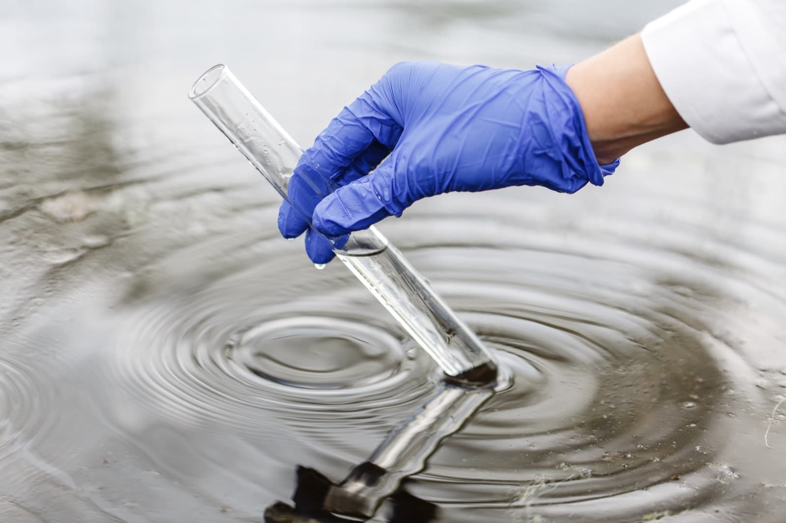 Collecting a water sample at a North Carolina home